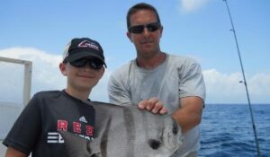 North Myrtle Beach Fishing Charters captain Ryan Werner out at sea catching nice fishes.